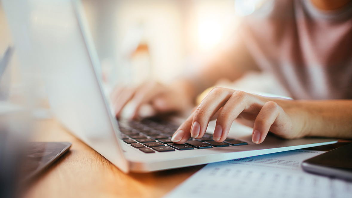 hands typing on a keyboard